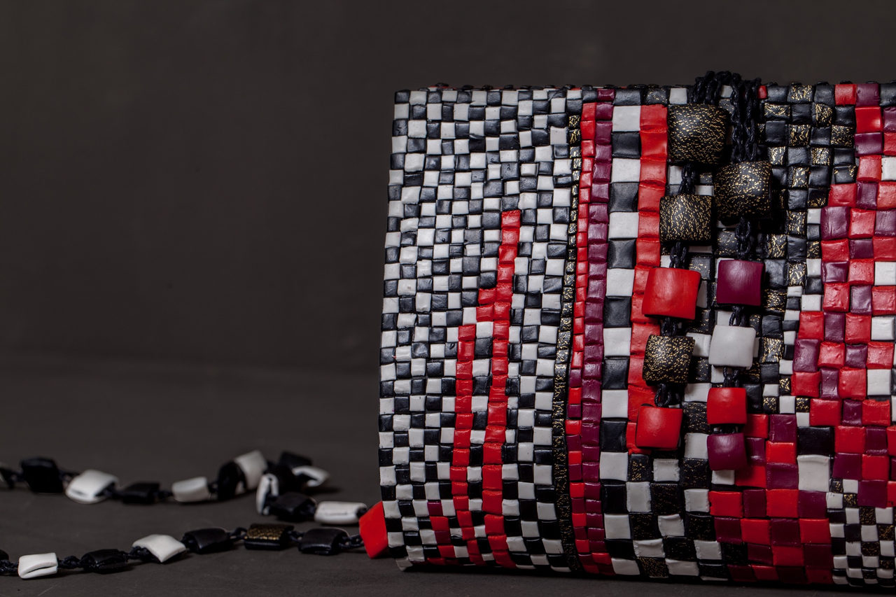GFW clutches in gold, black, silver, red and checkerboard